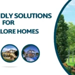 A promotional graphic with the text 'Eco-friendly Solutions for Explore Homes' on the left, featuring two circular images below showcasing a home and an outdoor patio area. On the right, a tree and a house behind a lawn are displayed with a curved blue border, emphasizing eco-friendly construction packages in Bangalore and house construction packages in Bangalore