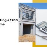 Construction site with a metal framework and a calculator on a white background, symbolizing building a 1200 sq ft home by home construction contractors, highlighting home construction in Bangalore.